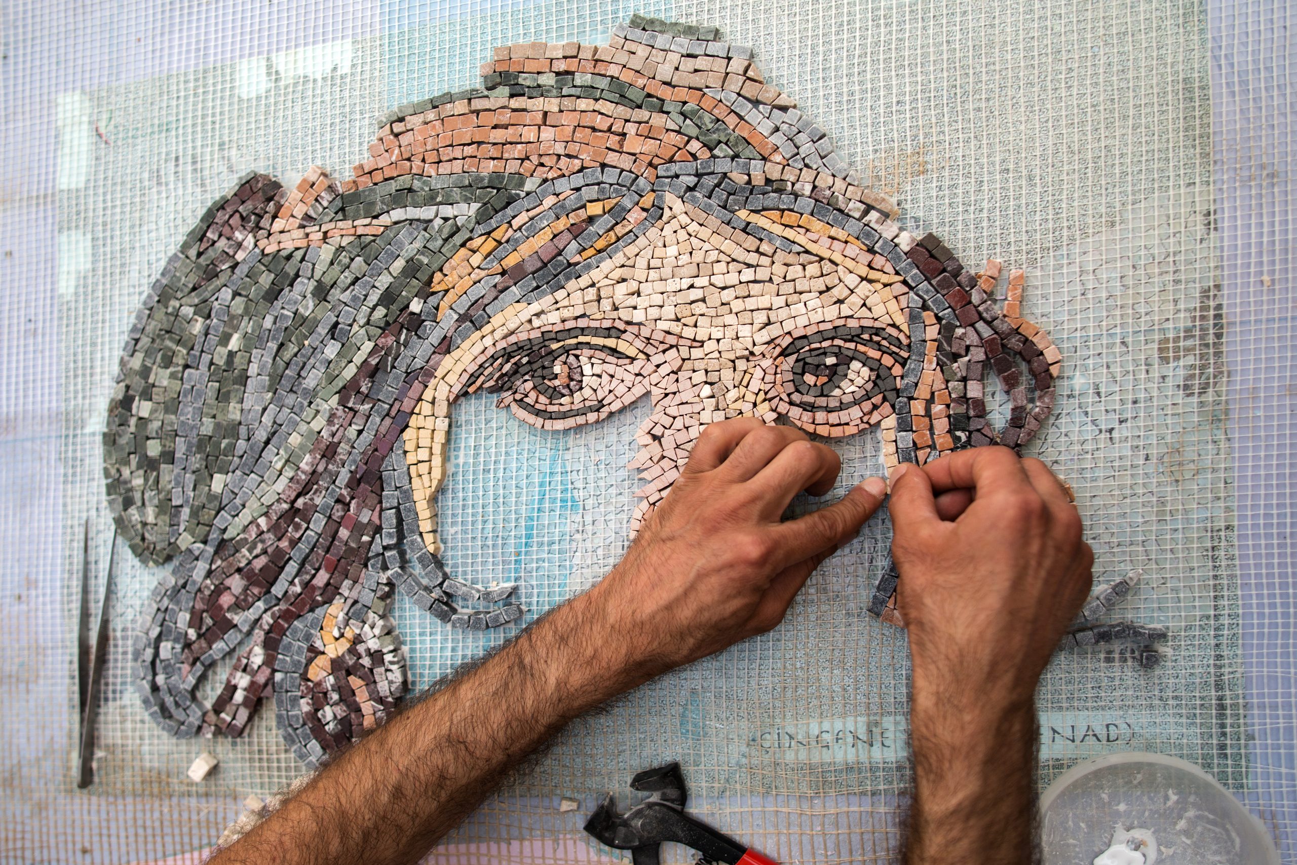 Man,Making,Mosaic